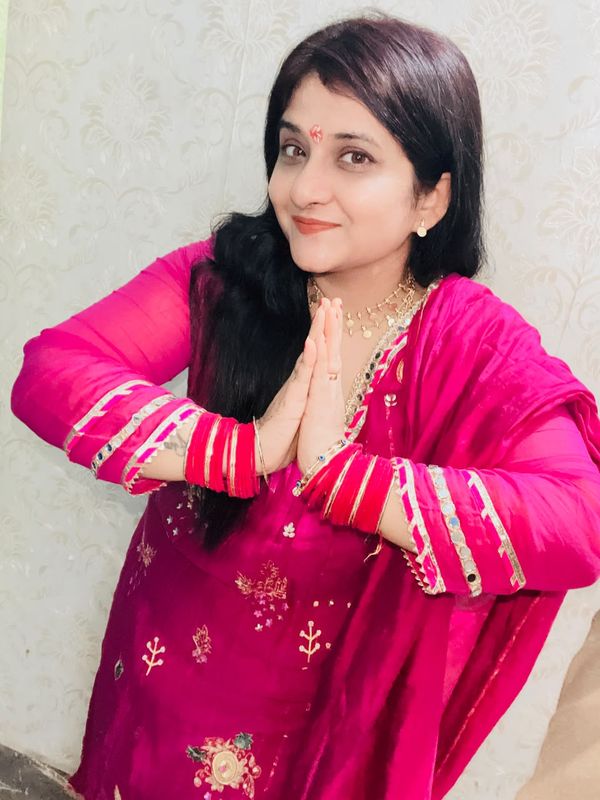 Vrinda Krishnan, tarot reader, greeting with folded hands
